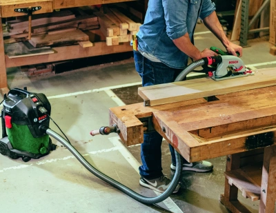 Строительный пылесос Bosch UniversalVac15 1000Вт (уборка: сухая/влажная) зеленый